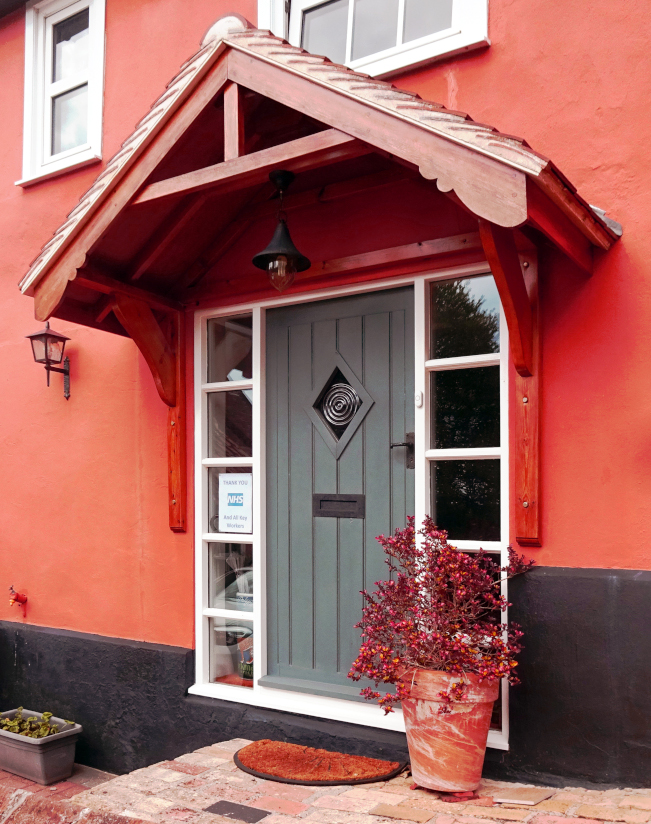 Tiled wooden porch and painted door